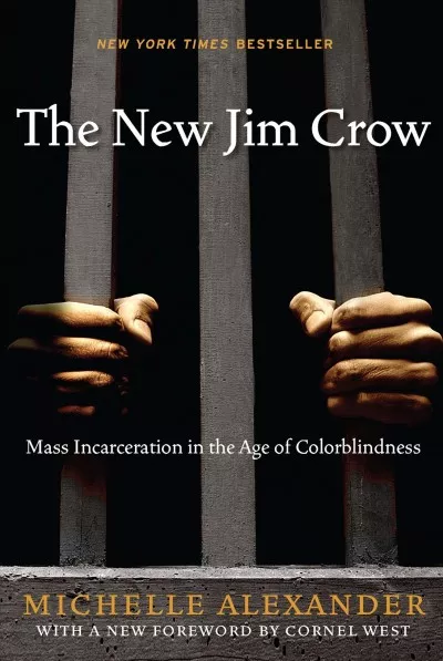 Cover of "The New Jim Crow: Mass Incarceration in the Age of Colorblindness" by Michelle Alexander, showing hands gripping